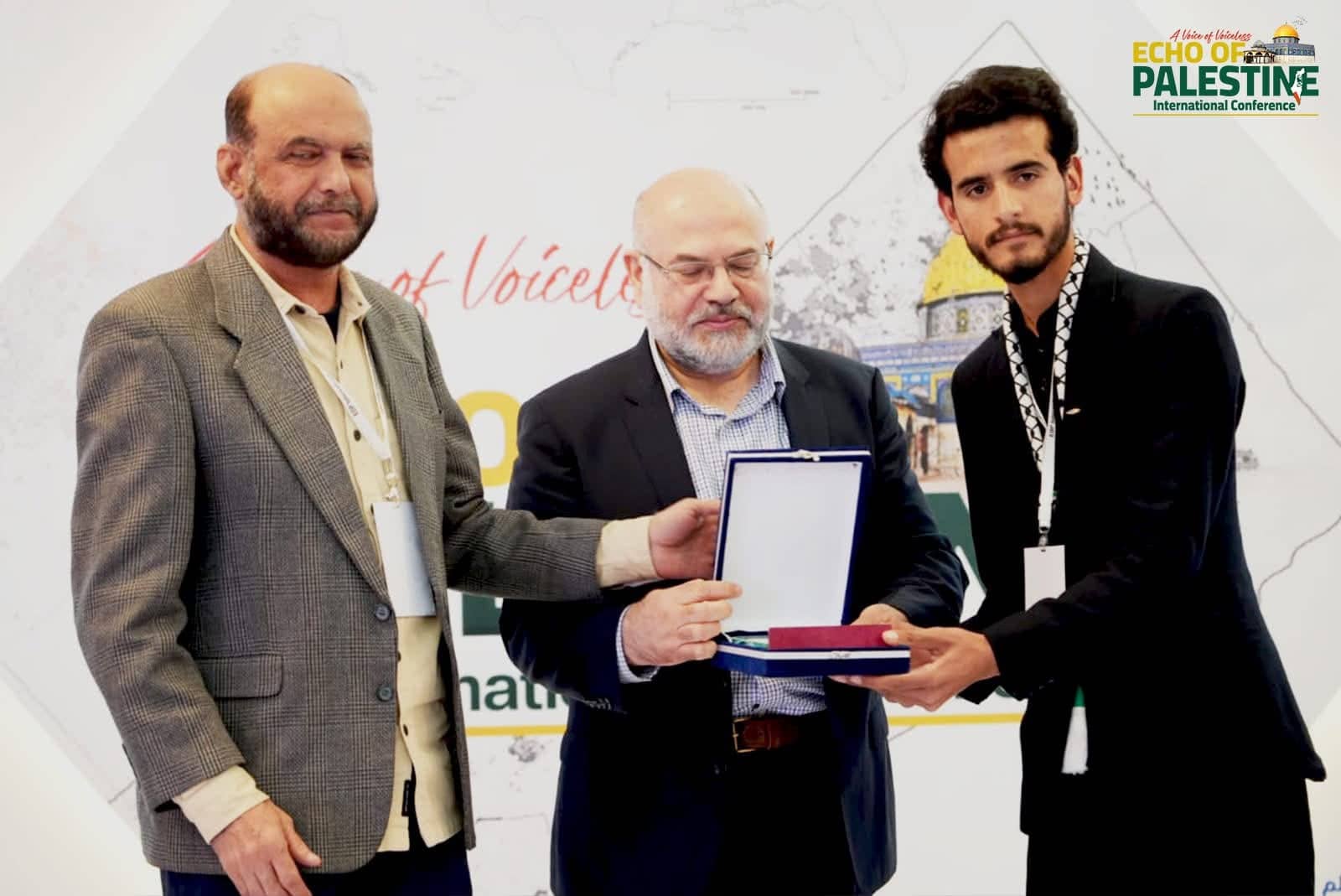 Shield presentation on stage at the Echo of Palestine International Conference