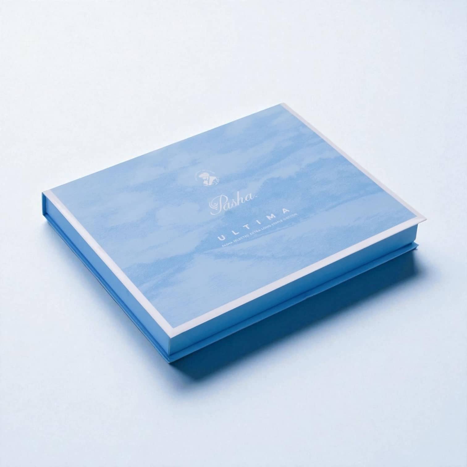 PackSmart pale blue two-piece apparel box with a watercolour sky print and a white lid edge.