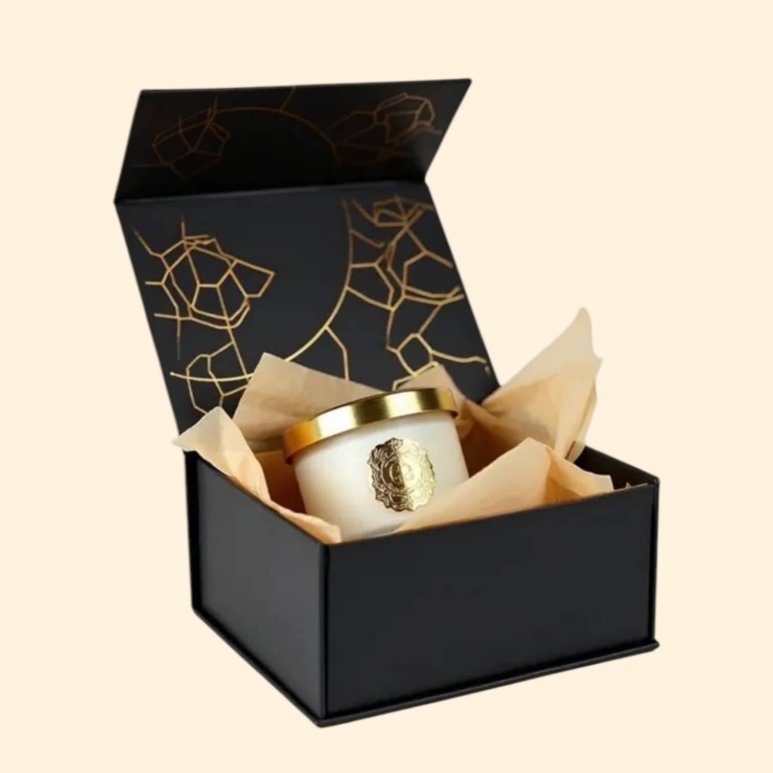 PackSmart black magnetic-closure rigid gift box with a gold line pattern, open to show a gold candle jar nested in tissue paper.