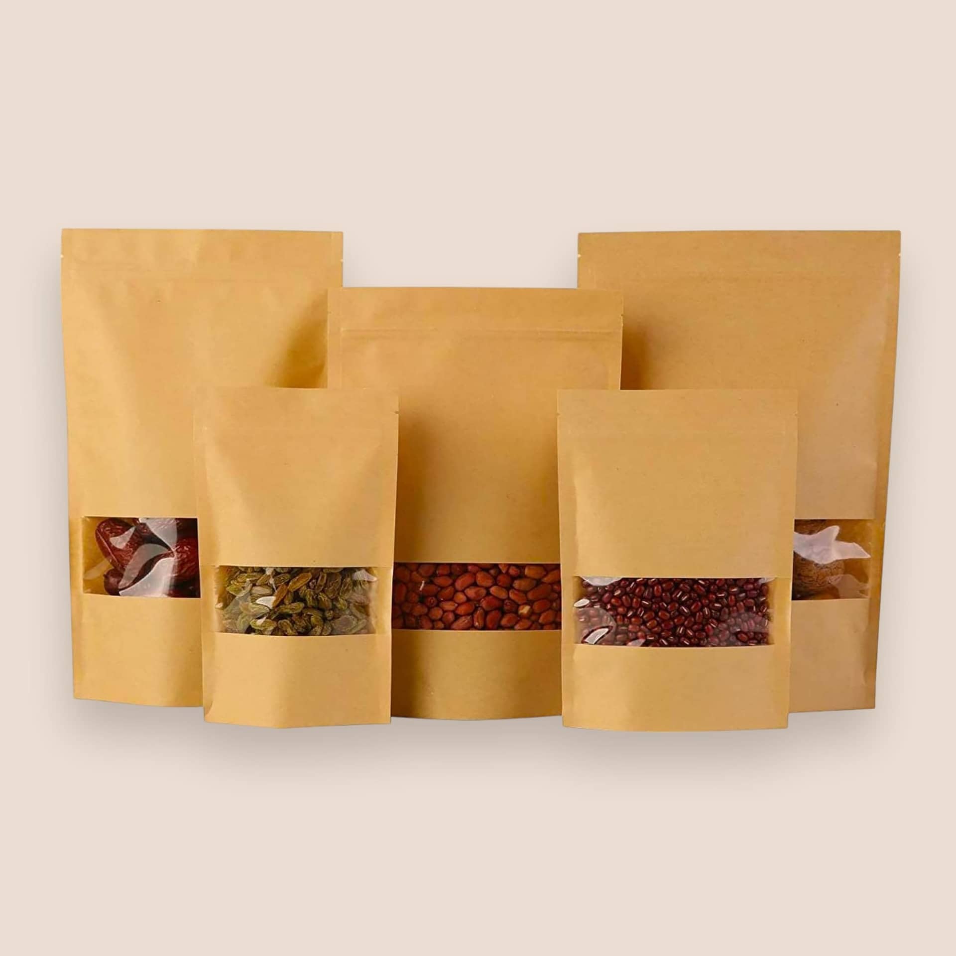PackSmart kraft stand-up pouches with windows showing spices, on a pale peach background.